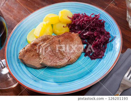 Veal steak with potato and sauerkraut 126201193