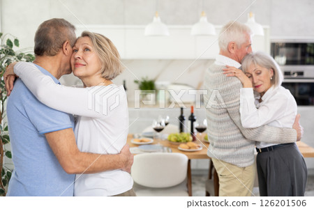 Couple of elderly man and woman dancing in kitchen 126201506
