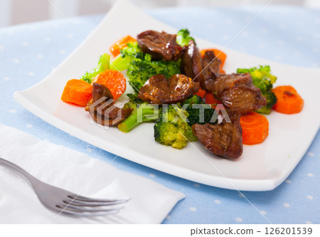 Braised chicken hearts with broccoli and carrots Braised chicken hearts with broccoli and carrots 126201539