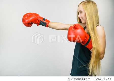 Woman in red gloves boxing Woman in red gloves boxing 126201735