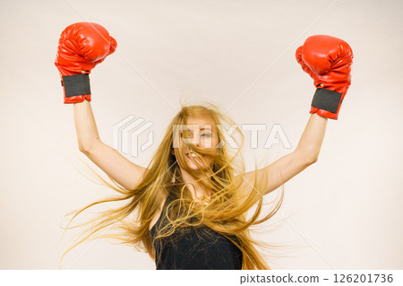 Woman in red gloves with arms up Woman in red gloves with arms up 126201736