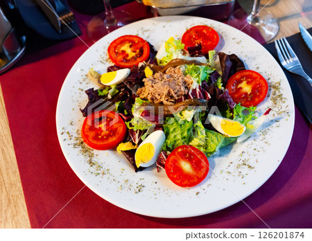 Salad with tuna, anchovies, asparagus and boiled egg 126201874
