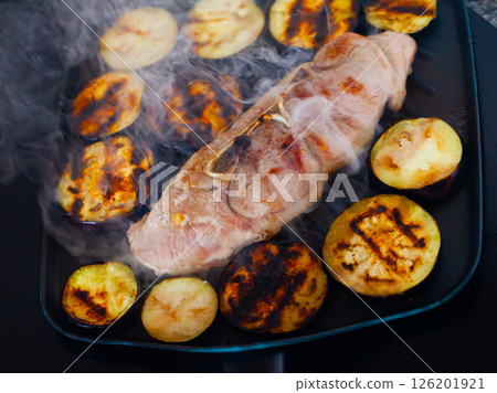 Pork shoulder roasted with eggplants in fry pan Pork shoulder roasted with eggplants in fry pan 126201921