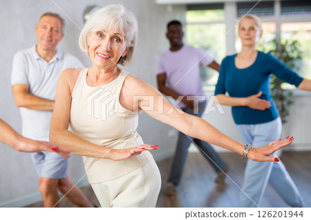 Senior woman dancing hip hop in studio practicing dance number. 126201944