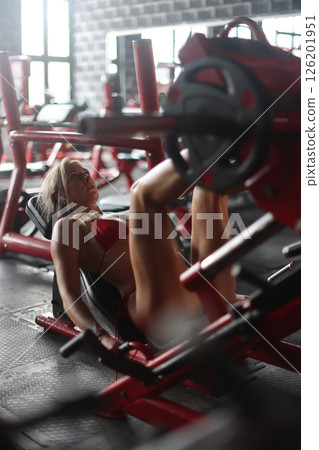 Empowered Women Training Hard in a Contemporary Gym for Strength and Fitness Success Empowered Women Training Hard in a Contemporary Gym for Strength and Fitness Success 126201951