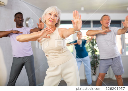 Senior woman learning to dance krump in modern choreographic studio 126201957