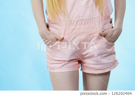 Woman legs wearing pink shorts 126202404