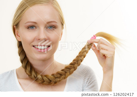 Blonde girl with long braid hair 126202417