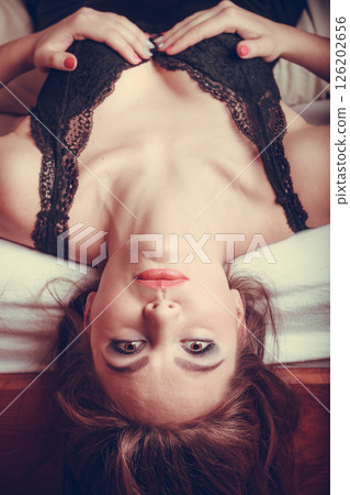 Sensual young woman in lingerie in bed. 126202656