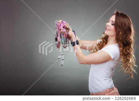 Pretty woman with jewelry necklaces ring bracelets 126202669
