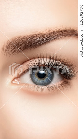 Comparison of natural and false eyelashes highlighting differences in length and thickness for eye beauty enhancement 126202770