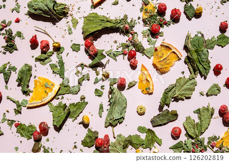 Scattered Dried Leaves, Berries and Orange Slices. Ingredients for Herbal Tea and Concept of Natural Wellness. Scattered Dried Leaves, Berries and Orange Slices. Ingredients for Herbal Tea and Concept of Natural Wellness. 126202819
