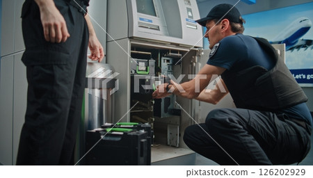Professional Guards Performing ATM Encashment Procedure in Airport Terminal 126202929