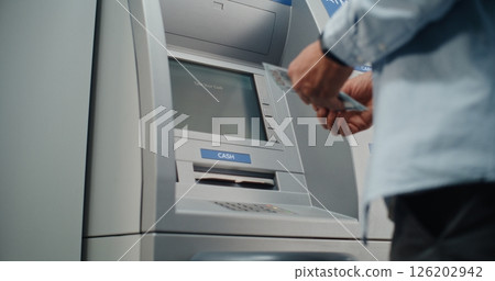 Close Up of Person Entering PIN Code. ATM Dispensing Money, User Taking Cash Dollars 126202942