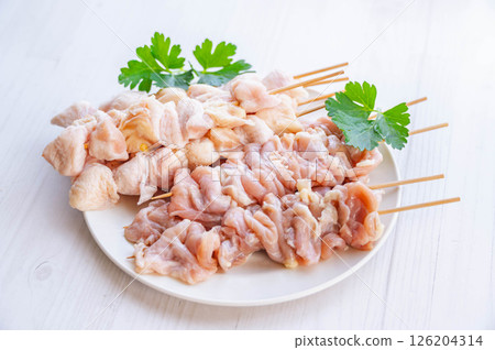 Skewered chicken thighs and belly 126204314