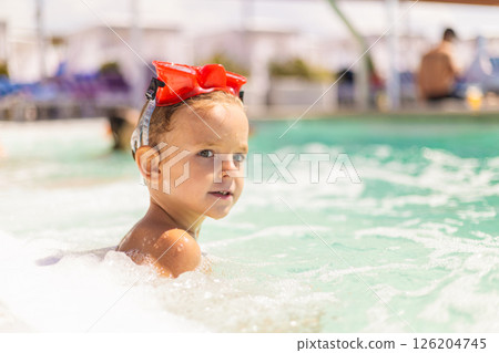 Child Enjoying a Swim in the Pool Child Enjoying a Swim in the Pool 126204745