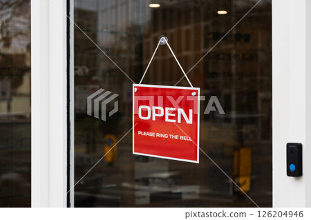 Glass Door with Red - Open - Sign and Instruction to Ring the Bell for Entry Glass Door with Red - Open - Sign and Instruction to Ring the Bell for Entry 126204946