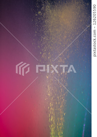 A colorful background with a splash of gold and purple. The colors are vibrant and the gold is scattered throughout the image 126205590