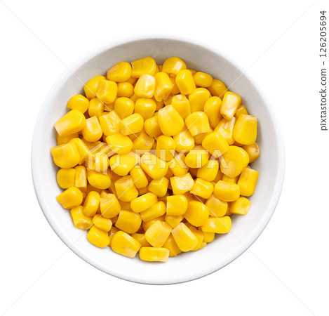 Canned corn, vegetable maize, whole sweet corn kernels in a white bowl. Variety of corn that is picked when in its milk state. Fully cooked kernels, preserved and ready to eat. Isolated, from above. 126205694