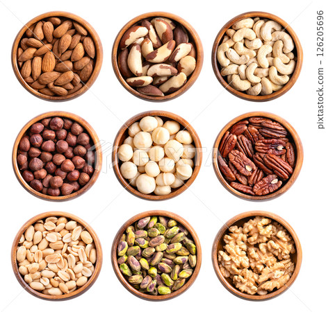 Shelled nuts in wooden bowls isolated from above. Almonds, Brazil nuts, and cashews in the 1st row, hazelnuts, macadamias, and pecans in the 2nd, peanuts, pistachios, and walnut halves in the 3rd row. Shelled nuts in wooden bowls isolated from above. Almonds, Brazil nuts, and cashews in the 1st row, hazelnuts, macadamias, and pecans in the 2nd, peanuts, pistachios, and walnut halves in the 3rd row. 126205696