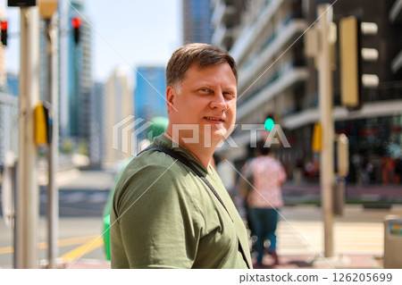 Middle-aged Blond Man in a Bustling City Street, Capturing Urban Life and Energy 126205699
