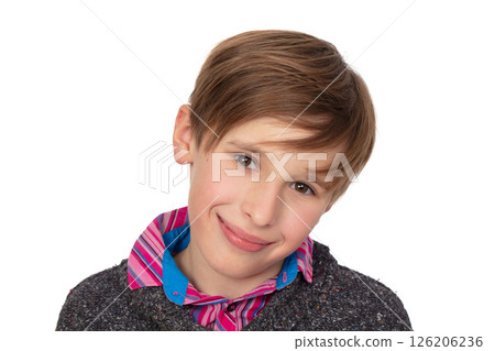 A close-up of a ten year old boy's face on a white background. He smiles and looks at the camera. A close-up of a ten year old boy's face on a white background. He smiles and looks at the camera. 126206236