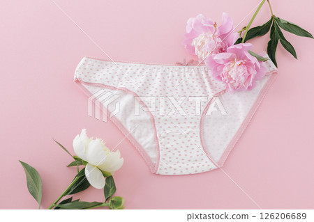 White cotton women's panties on the pink background. 126206689