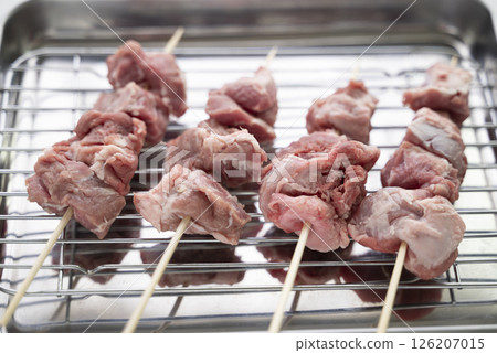 Pork cheeks being prepared 126207015