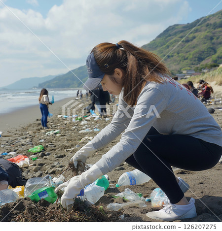 Woman picking up trash Woman picking up trash 126207275