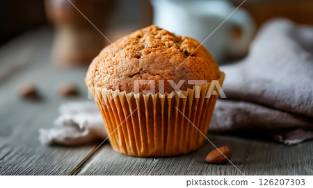 Freshly baked muffin on a wooden table Freshly baked muffin on a wooden table 126207303