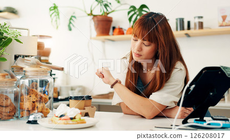 Bakery, woman and check watch time for schedule, deadline or waiting for customer at counter in small business. Cafe, worker and wristwatch with clock for delay, late or impatient waitress in startup 126208017