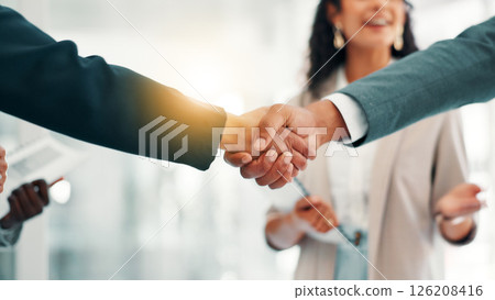 Business people, handshake or meeting with partnership for introduction, B2B or deal together at office. Closeup, employee or colleagues shaking hands with lens flare for agreement or job opportunity Business people, handshake or meeting with partnership for introduction, B2B or deal together at office. Closeup, employee or colleagues shaking hands with lens flare for agreement or job opportunity 126208416