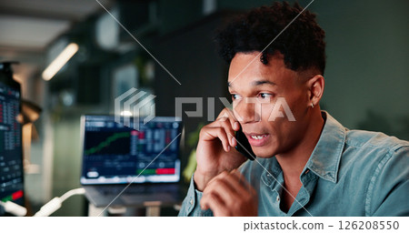 Phone call, communication and man in office with trading at night for client investment account. Technology, contact and financial analyst with computer for stock market risk analysis in workplace. Phone call, communication and man in office with trading at night for client investment account. Technology, contact and financial analyst with computer for stock market risk analysis in workplace. 126208550