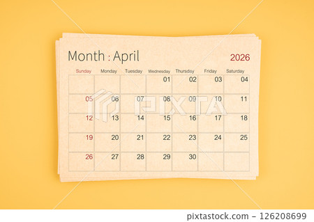 April 2026 calendar from brown recycle paper on yellow background. April 2026 calendar from brown recycle paper on yellow background. 126208699