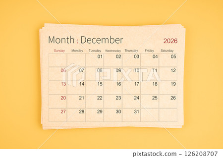 December 2026 calendar from brown recycle paper on yellow background. 126208707