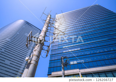 Tokyo cityscape in Japan. Disaster prevention in the city. View of the AM receiver mixer near the Sumitomo Real Estate Hama-rikyu Building. Tokyo cityscape in Japan. Disaster prevention in the city. View of the AM receiver mixer near the Sumitomo Real Estate Hama-rikyu Building. 126208727