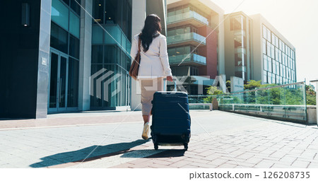 Business woman, back or walking with suitcase in city for travel, corporate real estate or job opportunity. Female person, realtor or traveler with luggage in an urban town for commute or career trip Business woman, back or walking with suitcase in city for travel, corporate real estate or job opportunity. Female person, realtor or traveler with luggage in an urban town for commute or career trip 126208735