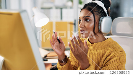 Computer, headphones and business woman on video call for communication with social media analyst. Webinar, virtual meeting and creative worker talk with tech for engagement results in startup office 126208935