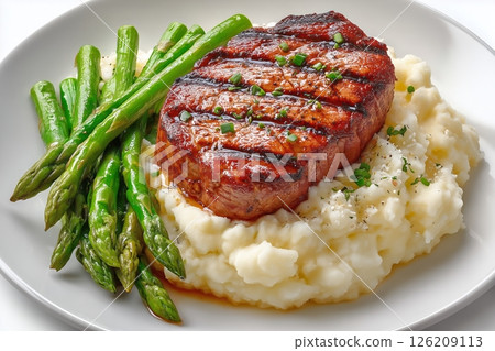 Delicious Grilled Steak With Mashed Potatoes and Asparagus on a White Plate 126209113