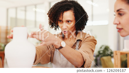 Collaboration, pottery and vase with woman in workshop together for manufacturing or production. Art, creative and design with potter team in boutique or small business studio for retail ceramics 126209187