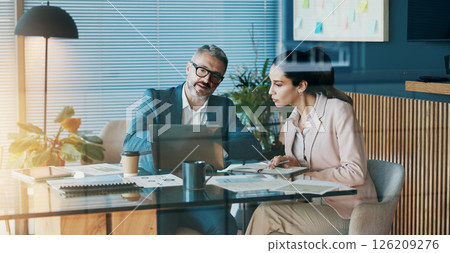 Paperwork, laptop and business people in office with discussion for company investment deal. Computer, documents and finance manager with investor client for meeting with dividend report in workplace 126209276