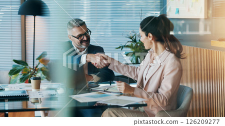 Shaking hands, agreement and business people in office for partnership, collaboration or finance deal. Meeting, welcome and financial manager with client for handshake with investment contract. Shaking hands, agreement and business people in office for partnership, collaboration or finance deal. Meeting, welcome and financial manager with client for handshake with investment contract. 126209277