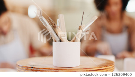 Pottery, art and tools in workshop for process, sculpture design and learning artwork. Closeup, people and artistic equipment for craft production, handmade hobby and creative lesson in ceramic class Pottery, art and tools in workshop for process, sculpture design and learning artwork. Closeup, people and artistic equipment for craft production, handmade hobby and creative lesson in ceramic class 126209400