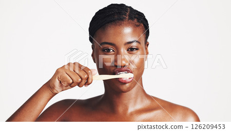 Toothbrush, dental hygiene and portrait of black woman in studio for wellness, brushing teeth and cleaning. Space, whitening and face of person for oral care, health and grooming on white background Toothbrush, dental hygiene and portrait of black woman in studio for wellness, brushing teeth and cleaning. Space, whitening and face of person for oral care, health and grooming on white background 126209453