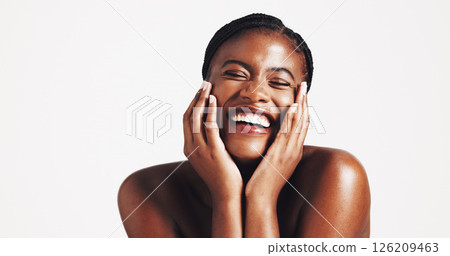 Makeup, shine or black woman with smile for skincare, portrait or acne solution on white background. Studio space, playful or face of happy African girl model with confidence, beauty mockup or glow Makeup, shine or black woman with smile for skincare, portrait or acne solution on white background. Studio space, playful or face of happy African girl model with confidence, beauty mockup or glow 126209463