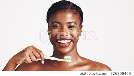 Toothbrush, dental and portrait of black woman in studio for plaque, brushing teeth and cleaning. Space, mouth hygiene and face of person for oral care, whitening and grooming on white background 126209469