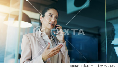 Phone call, business and woman in office by window for discussion, corporate meeting and planning. Professional, finance consultant and person on smartphone for contact, communication and talking Phone call, business and woman in office by window for discussion, corporate meeting and planning. Professional, finance consultant and person on smartphone for contact, communication and talking 126209489