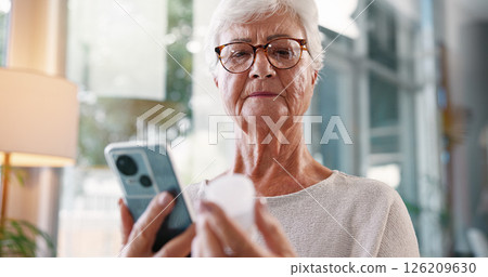 Elderly woman, research and medication with phone for telehealth, information or prescription at home. Senior, female person or patient with mobile smartphone or pills for symptoms or side effects Elderly woman, research and medication with phone for telehealth, information or prescription at home. Senior, female person or patient with mobile smartphone or pills for symptoms or side effects 126209630