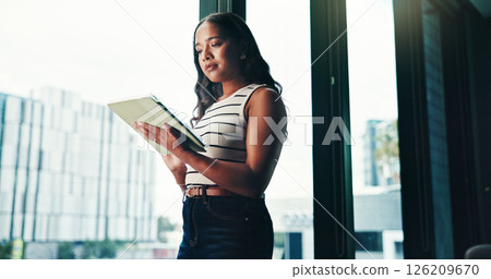 Office, businesswoman or journalist with tablet for research, news story or notification for blog post. Low angle, female person or editor with digital for publication, article information or reading 126209670
