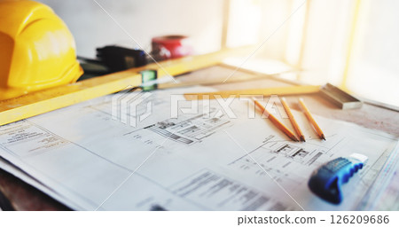 Architecture, blueprint and drawing equipment on table for building renovation, design illustration and layout. Paperwork, scale and tools at construction site for floor plan and development process 126209686